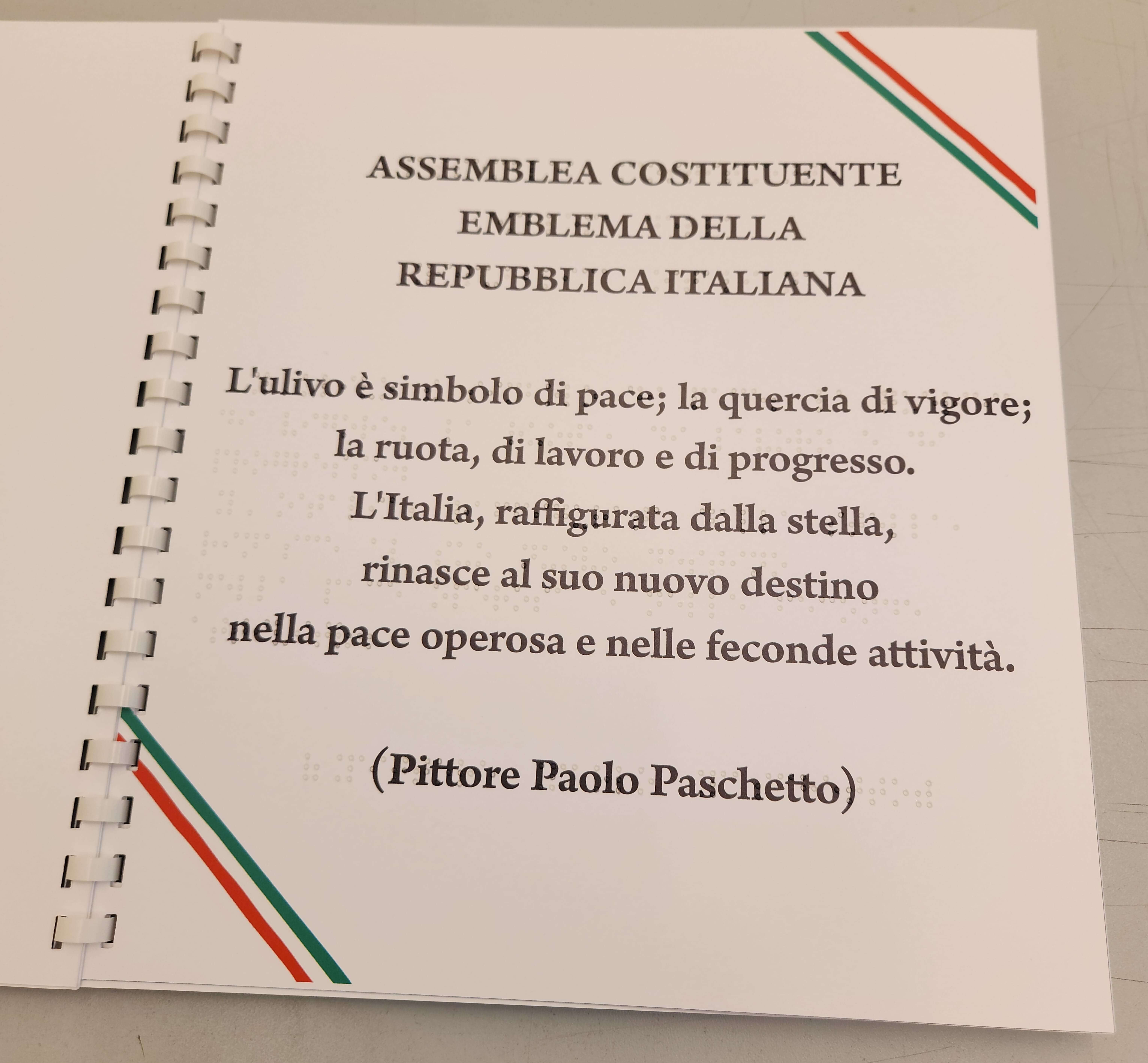 Pagina didattica che spiega i simboli dell'emblema della Repubblica Italiana con testo in nero e Braille.